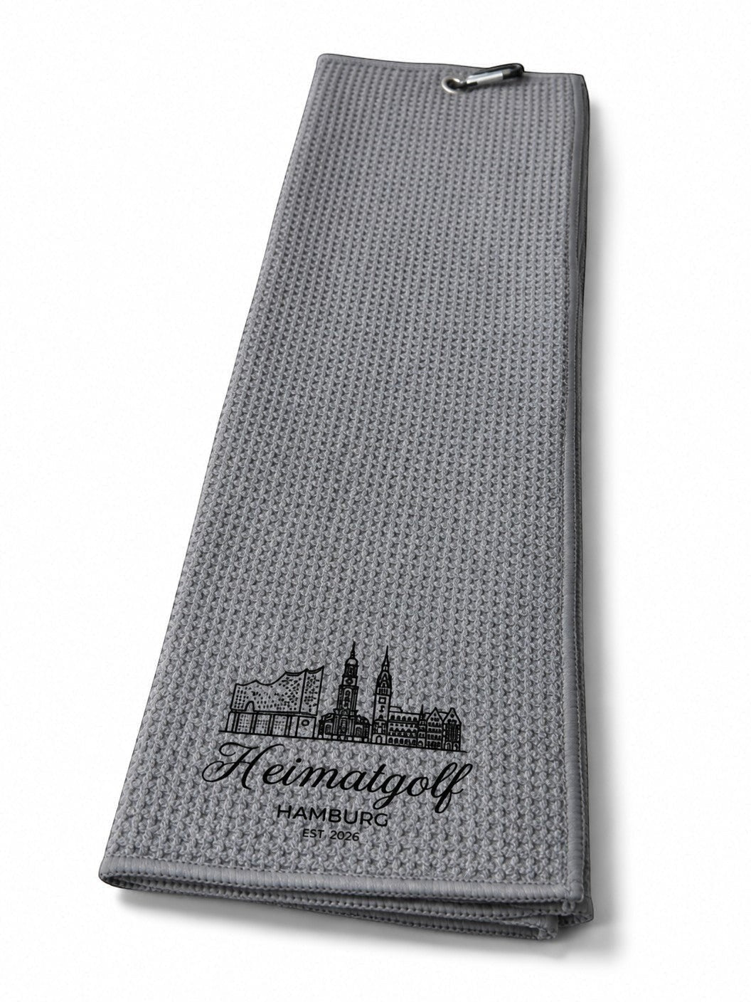 City Golf Shop Waffel-Golftuch in Grau mit Hamburg Skyline Motiv und Karabinerhaken für das Golfbag.