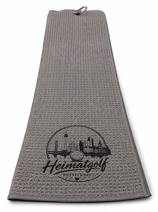 City Golf Shop Waffel-Golftuch in Grau mit schwarzem Düsseldorf-Motiv und Karabinerhaken für das Golfbag.