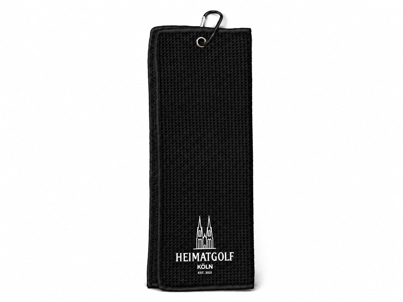 City Golf Shop Waffel-Golftuch in Schwarz mit weißem Domspitzen-Motiv und Karabinerhaken zur Befestigung am Golfbag.